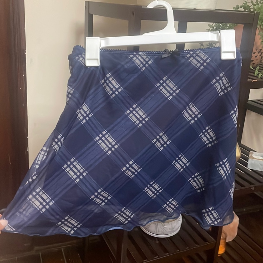 Flowy plaid blue skirt with cute trim and bow on top